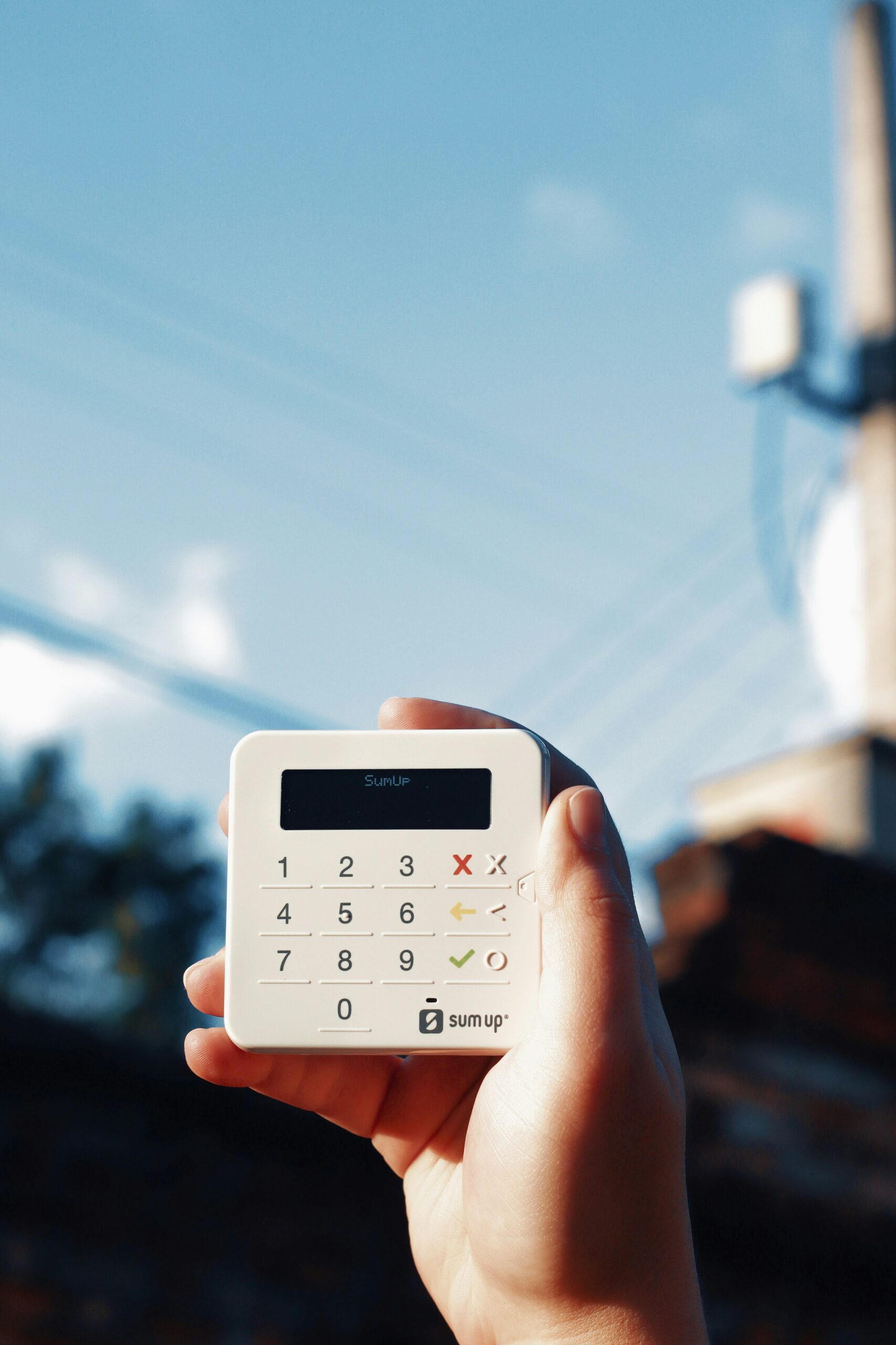 A person holding a calculator in their hand